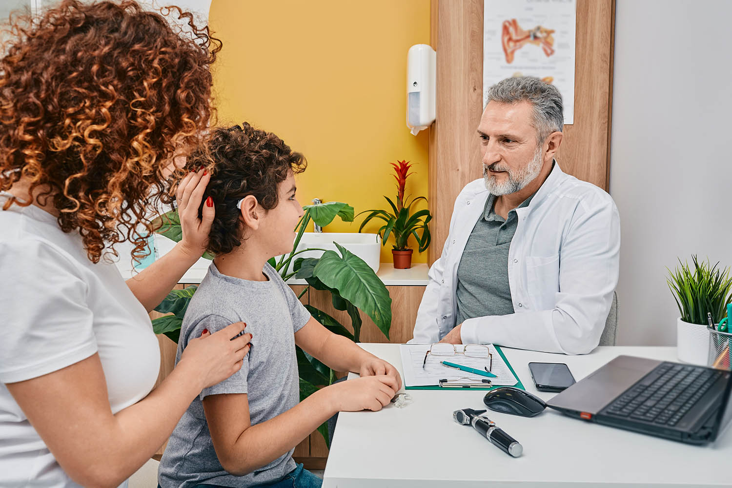 Deaf girl with Mom and doctor